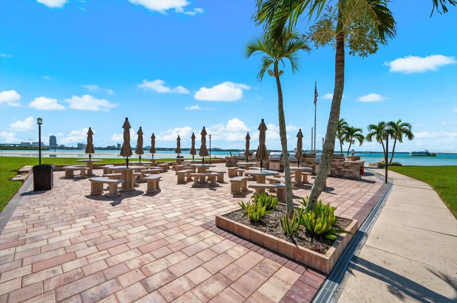 Large Picnic tables at the grill area - 868 BAYWAY BLVD #307, CLEARWATER BEACH