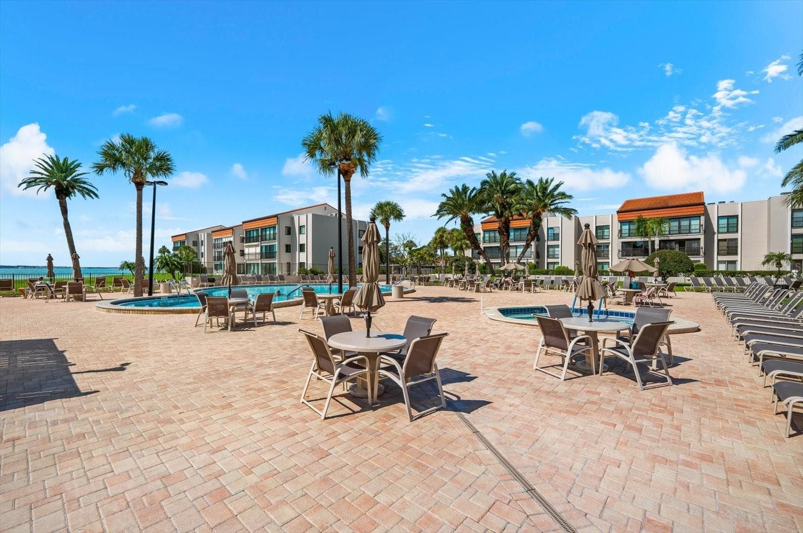 Pool are is large with plenty of seating and is close to the private beach area - 868 BAYWAY BLVD #307, CLEARWATER BEACH