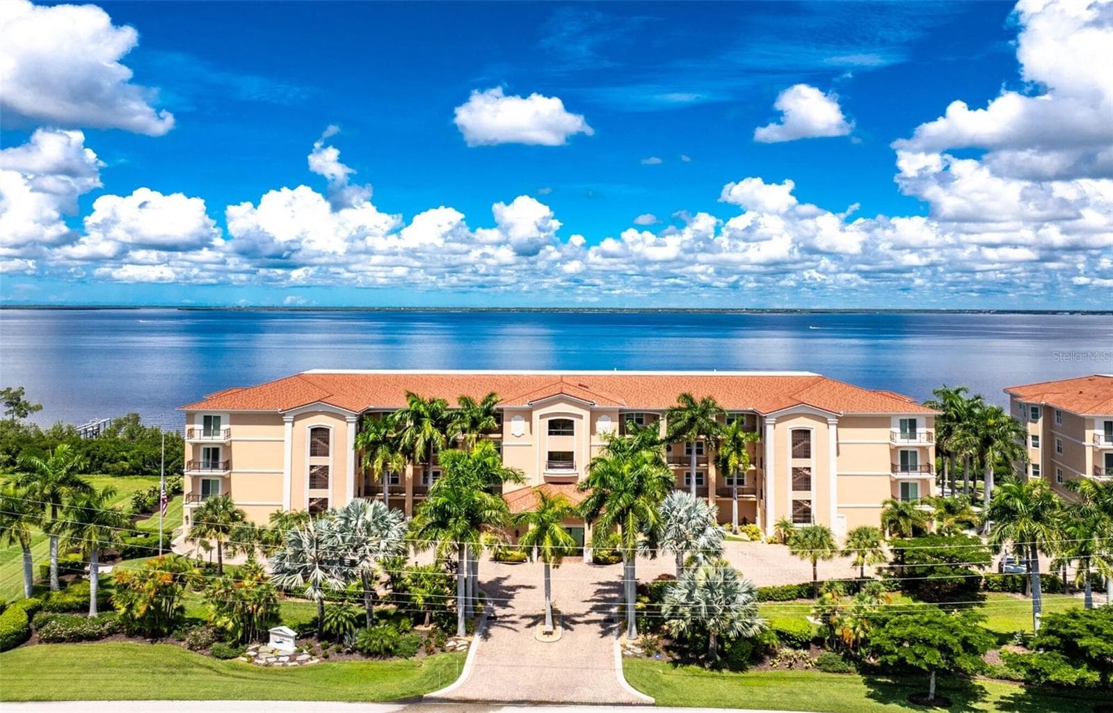 Lush tropical landscaping surround this contemporary design residing on vibrant harbor teeming with marine life and wide variety of boats activity every day - 95 N MARION CT #135, PUNTA GORDA