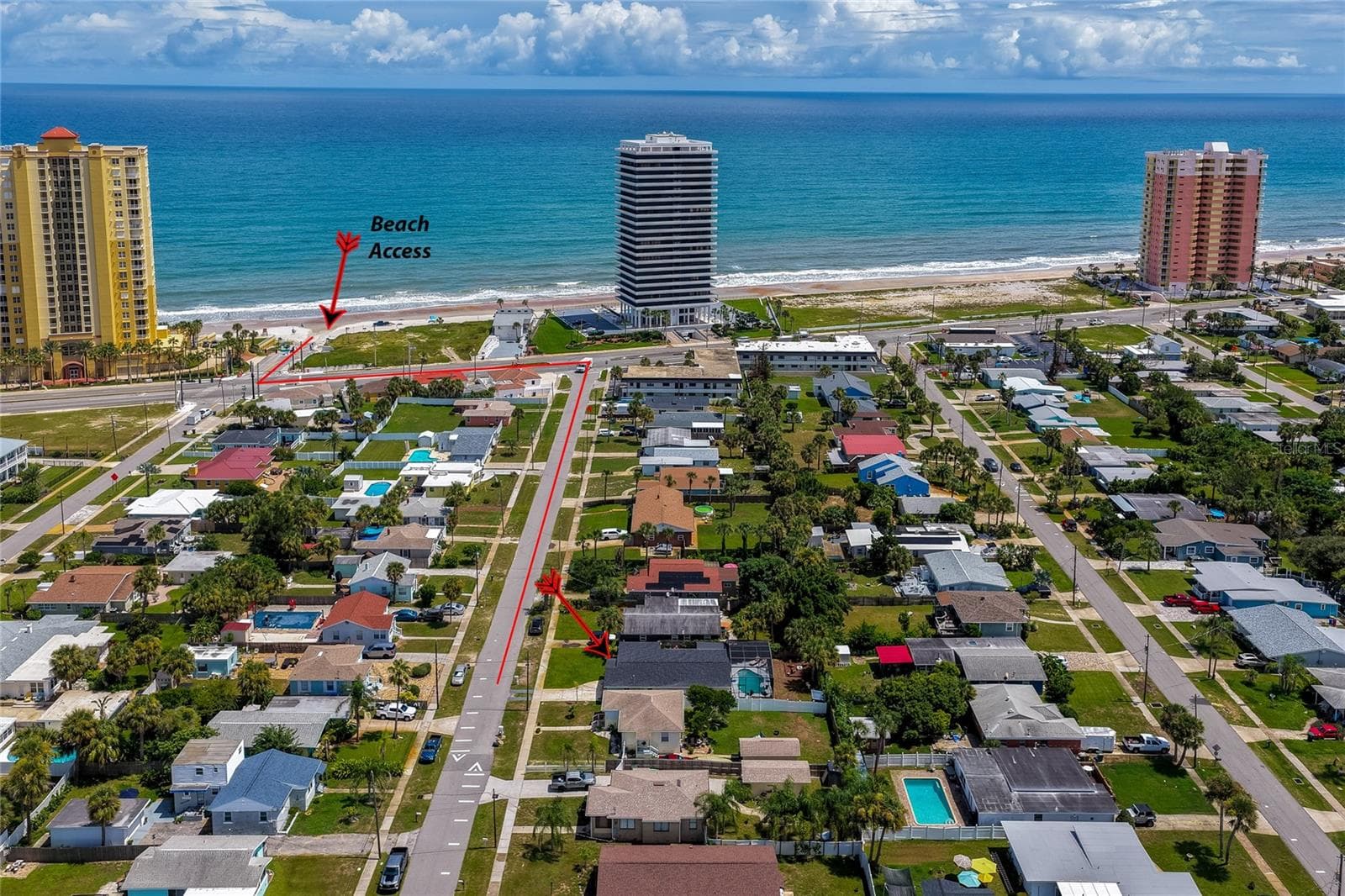 Aerial neighborhood photo with annotated directions showing the quick, direct route down the street to local beach access. - 348 WOODLAND AVE, DAYTONA BEACH
