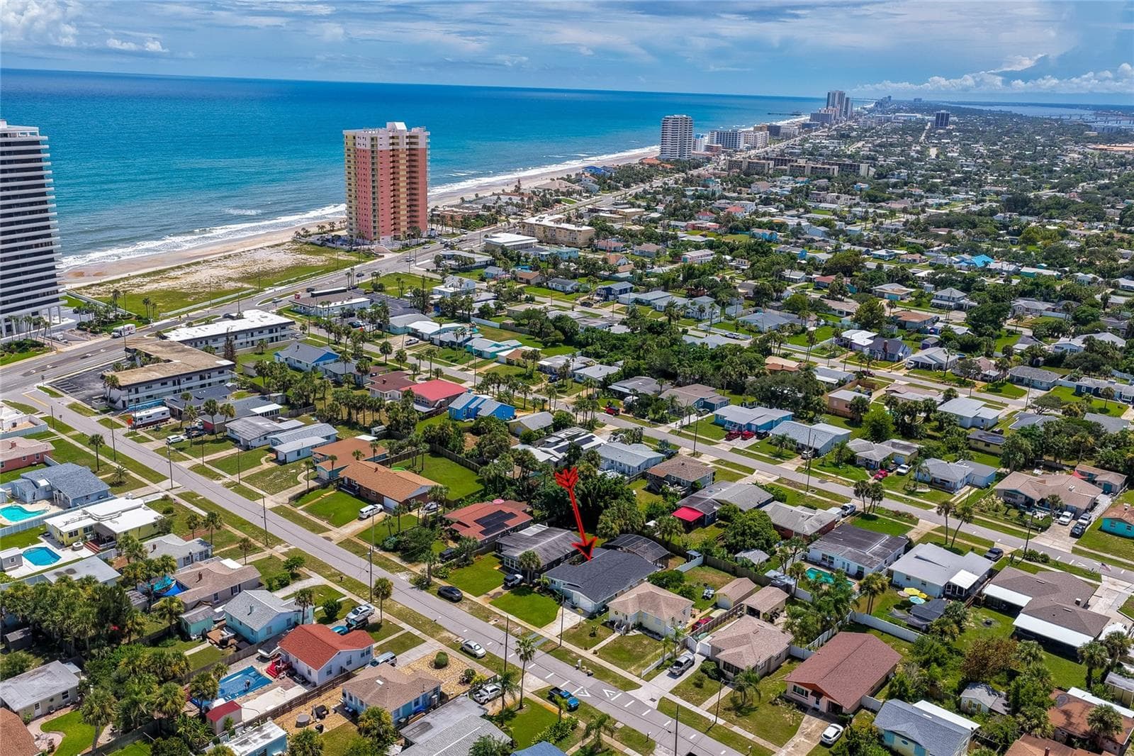 Expansive aerial view pointing out the property's location relative to the nearby oceanfront and coastal high-rises. - 348 WOODLAND AVE, DAYTONA BEACH