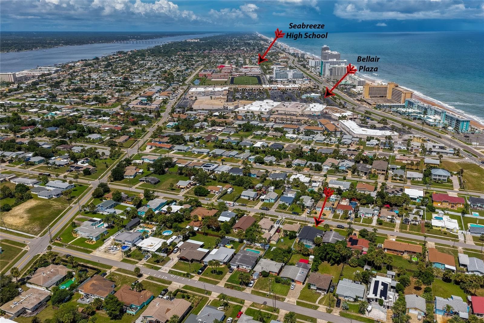 Wide aerial shot pointing out the residence's convenient proximity to local landmarks, including Bellair Plaza and Seabreeze High School. - 348 WOODLAND AVE, DAYTONA BEACH