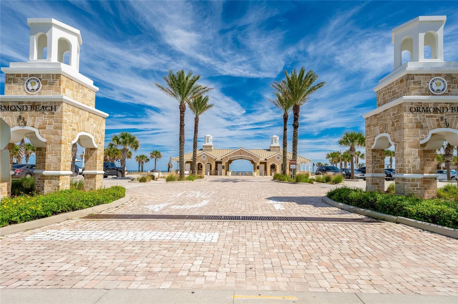 Palm-lined entrance to nearby Andy Romano Beachfront Park welcomes visitors to an attractive oceanfront destination with the Atlantic visible beyond. - 348 WOODLAND AVE, DAYTONA BEACH