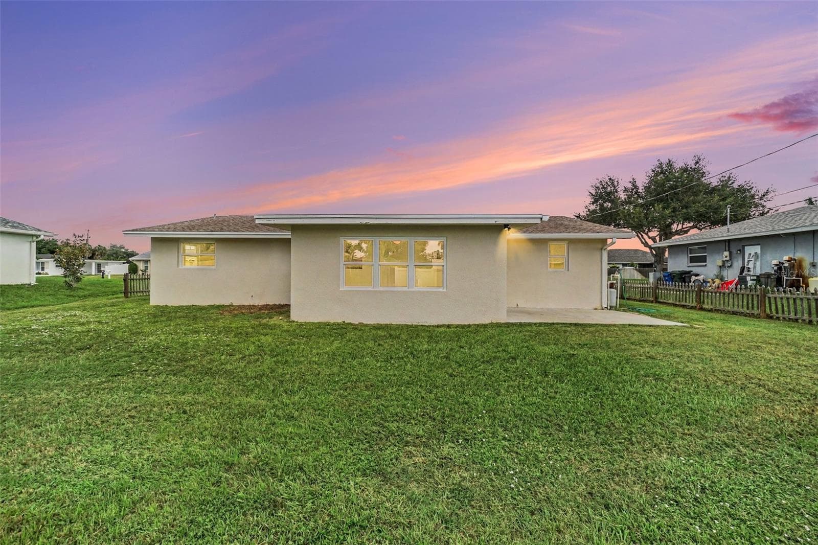 Back of house at twilight - 305 SHELL RD, VENICE