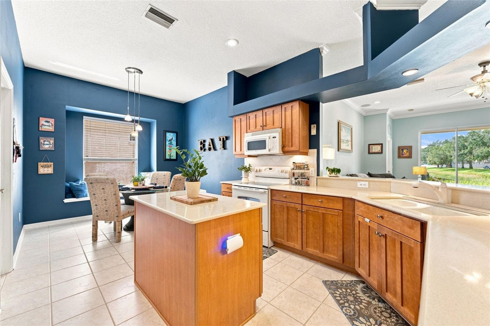 Kitchen overlooks the family room - 18022 LAKE REFLECTIONS BLVD, LUTZ
