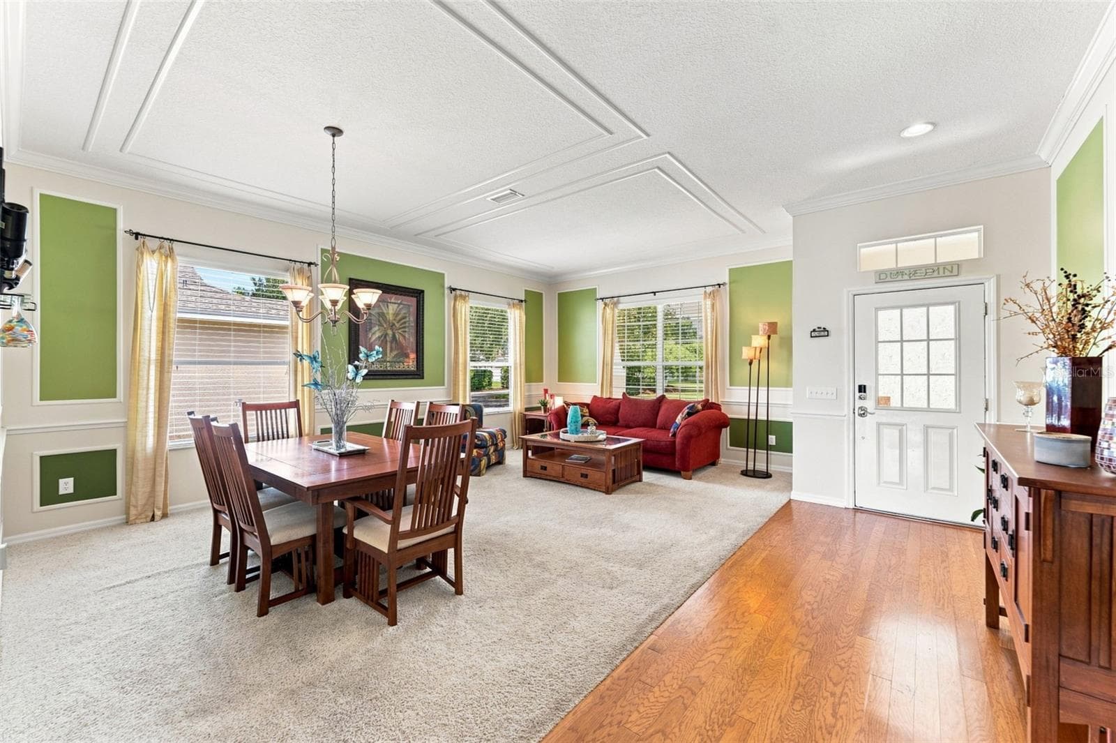 Welcome in-Notice the details such as the crown molding accents and warm wood flooring - 18022 LAKE REFLECTIONS BLVD, LUTZ