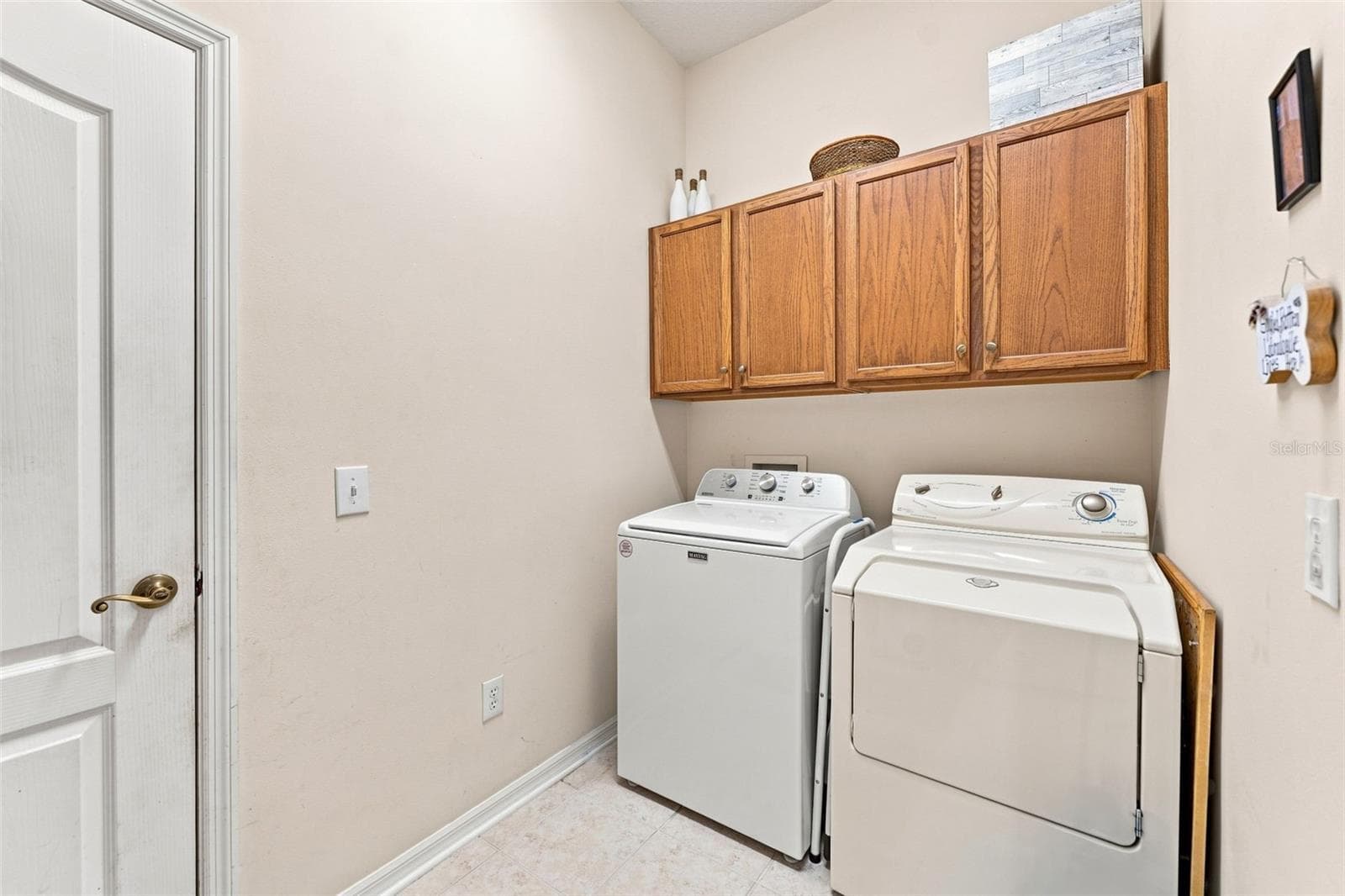 Inside Laundry Room with storage - 18022 LAKE REFLECTIONS BLVD, LUTZ