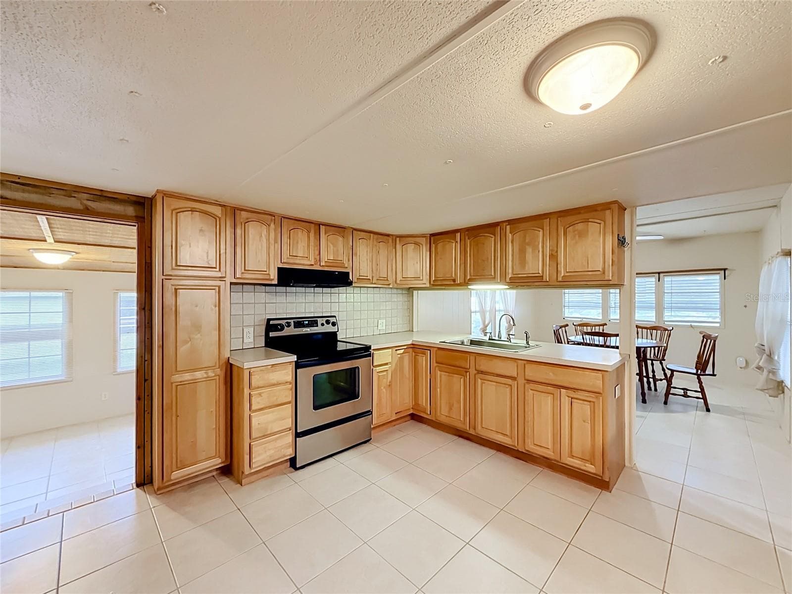 Kitchen open to LR and Dining - 1514 RIDGE RD, TAVARES