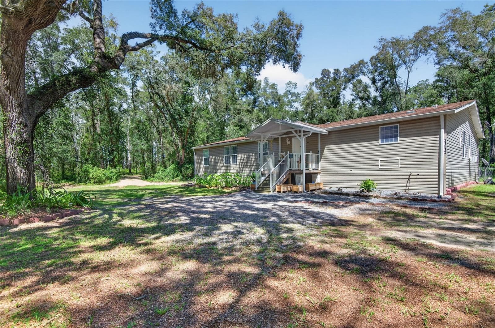 Manufactured Home at 21812 FIELD OF DREAMS LN, DADE CITY, photo 5 of 58