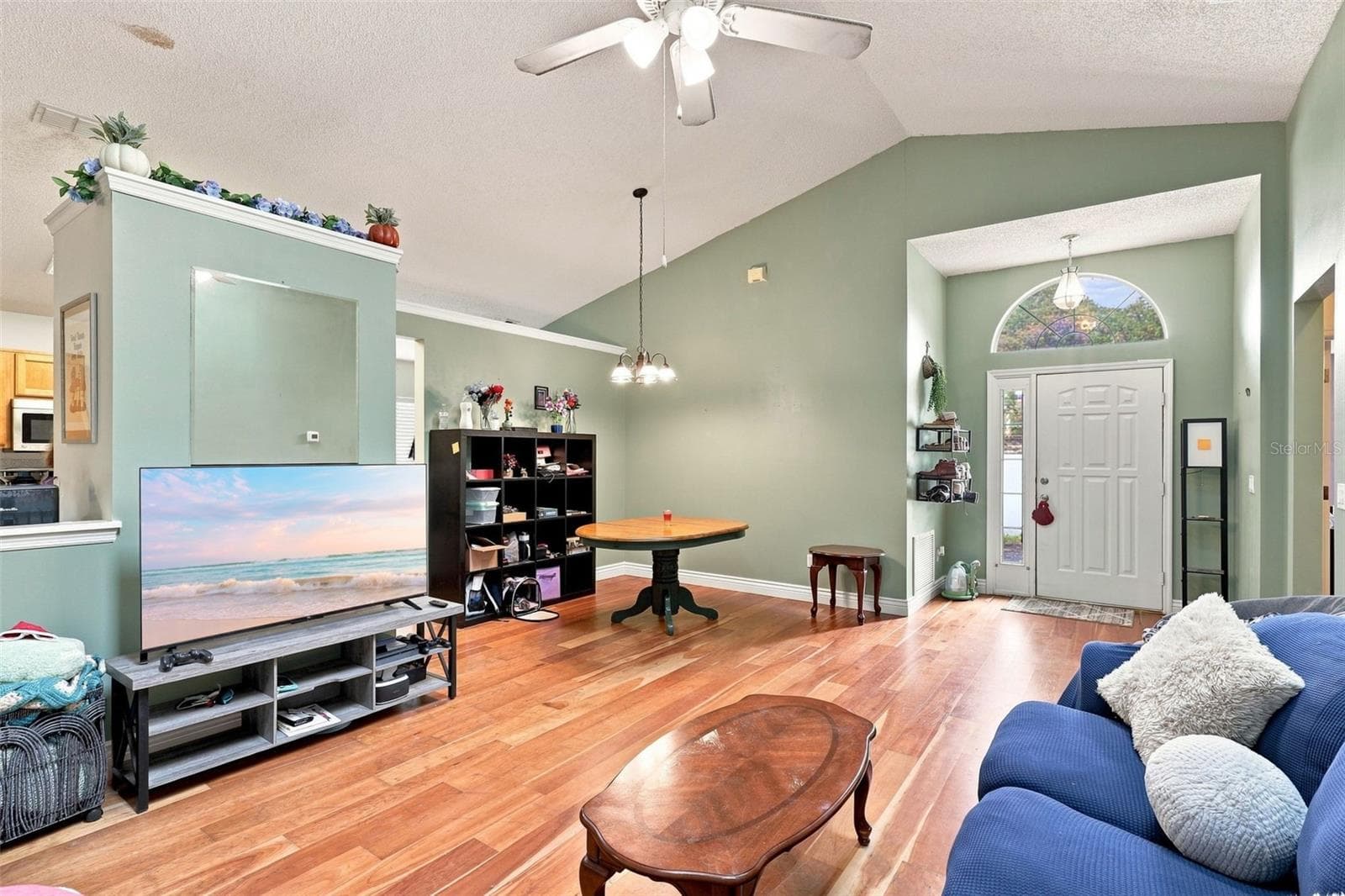 An additional view of the main living area shows the home's open layout and welcoming entry. - 13637 EMERALDVIEW DR, ORLANDO