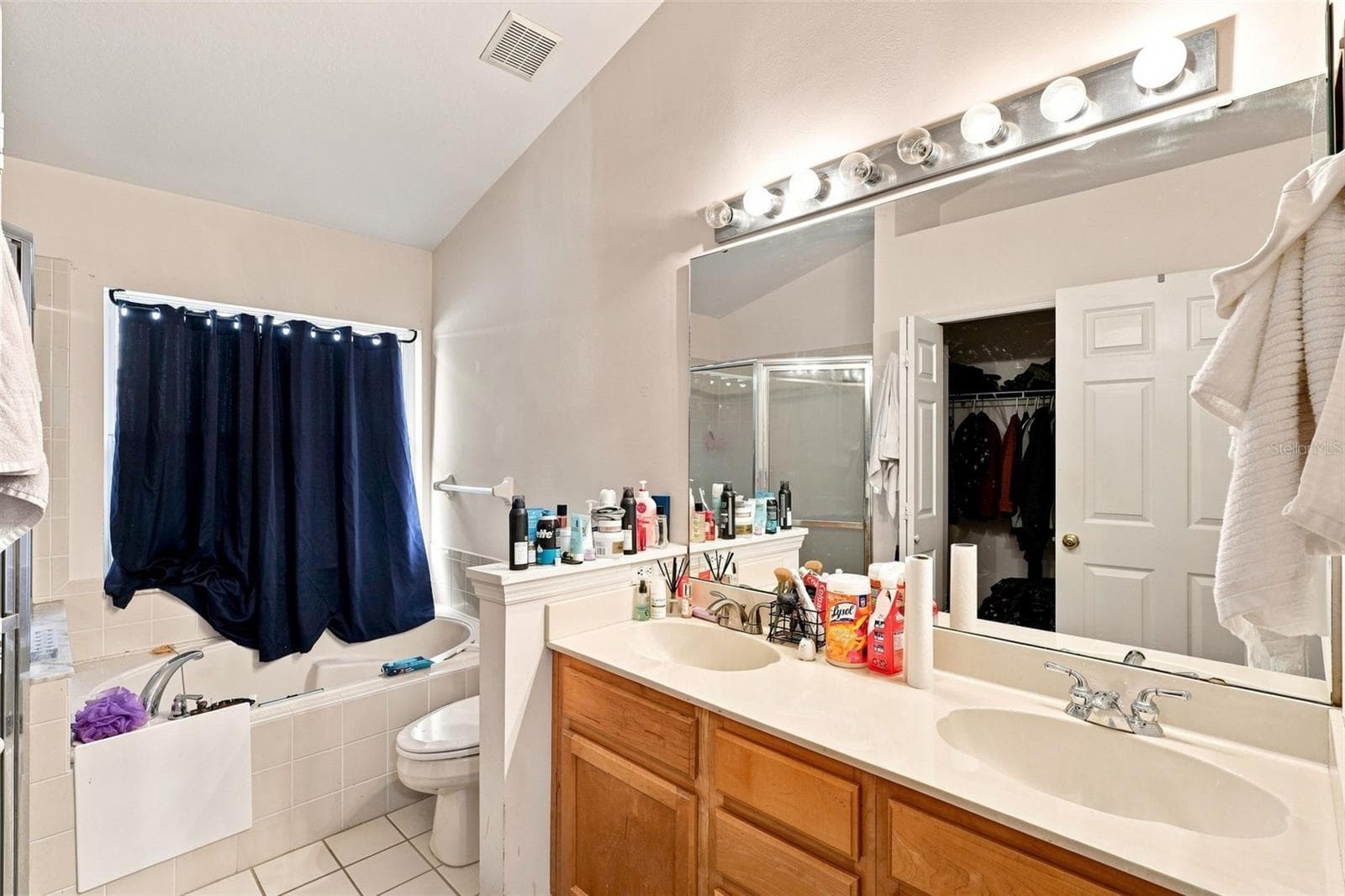 Primary bathroom with dual-sink vanity and generous counter space. - 13637 EMERALDVIEW DR, ORLANDO