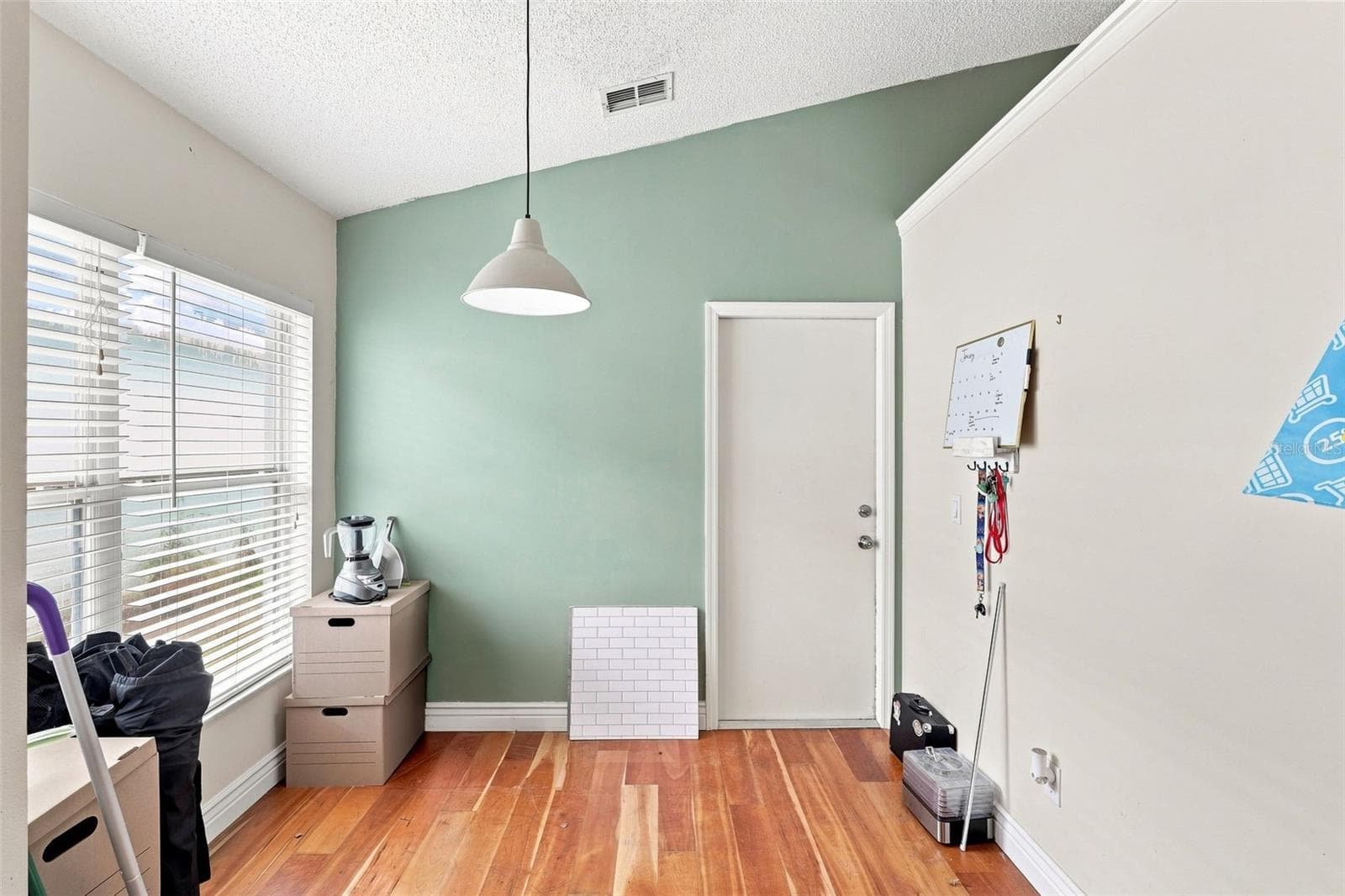 Bright bonus area with wood flooring and natural light offers additional flexible space - 13637 EMERALDVIEW DR, ORLANDO