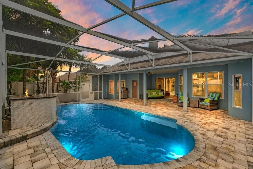 Virtially Staged Twilight Paver Deck and Screen In Pool with Water / Fire Feature - 3732 GATLIN RIDGE DR, ORLANDO