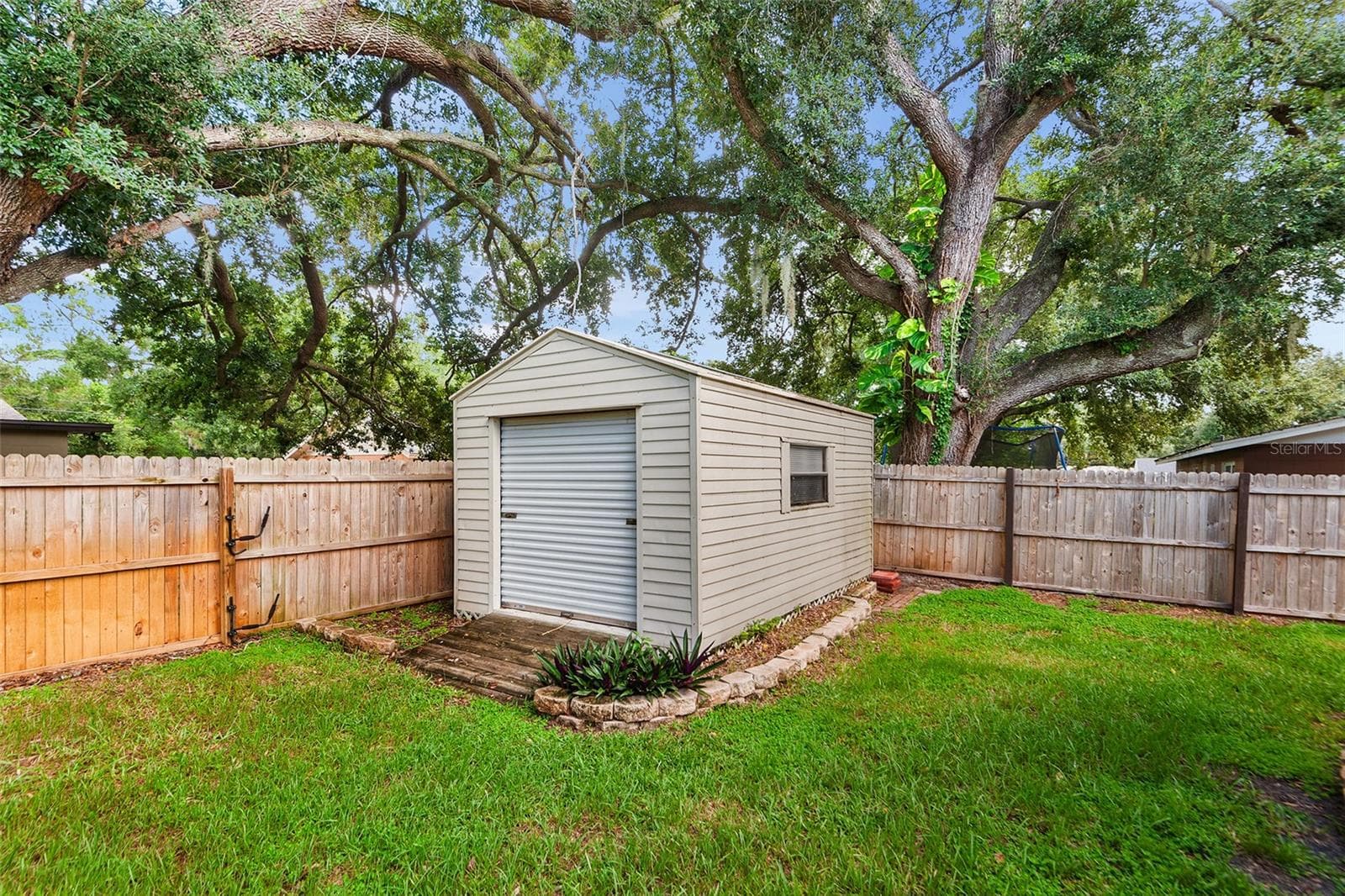 10 x 16 Storage or work shed  w/ Roll Up Door & Power and Light - 216 SHORE LOOP, WINTER HAVEN