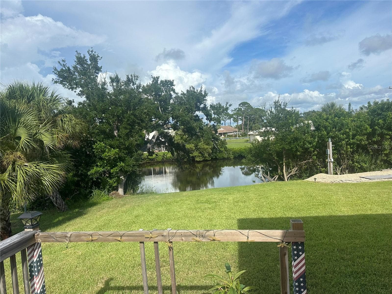 Overlooking pond - 200 MONTANA AVE, NOKOMIS