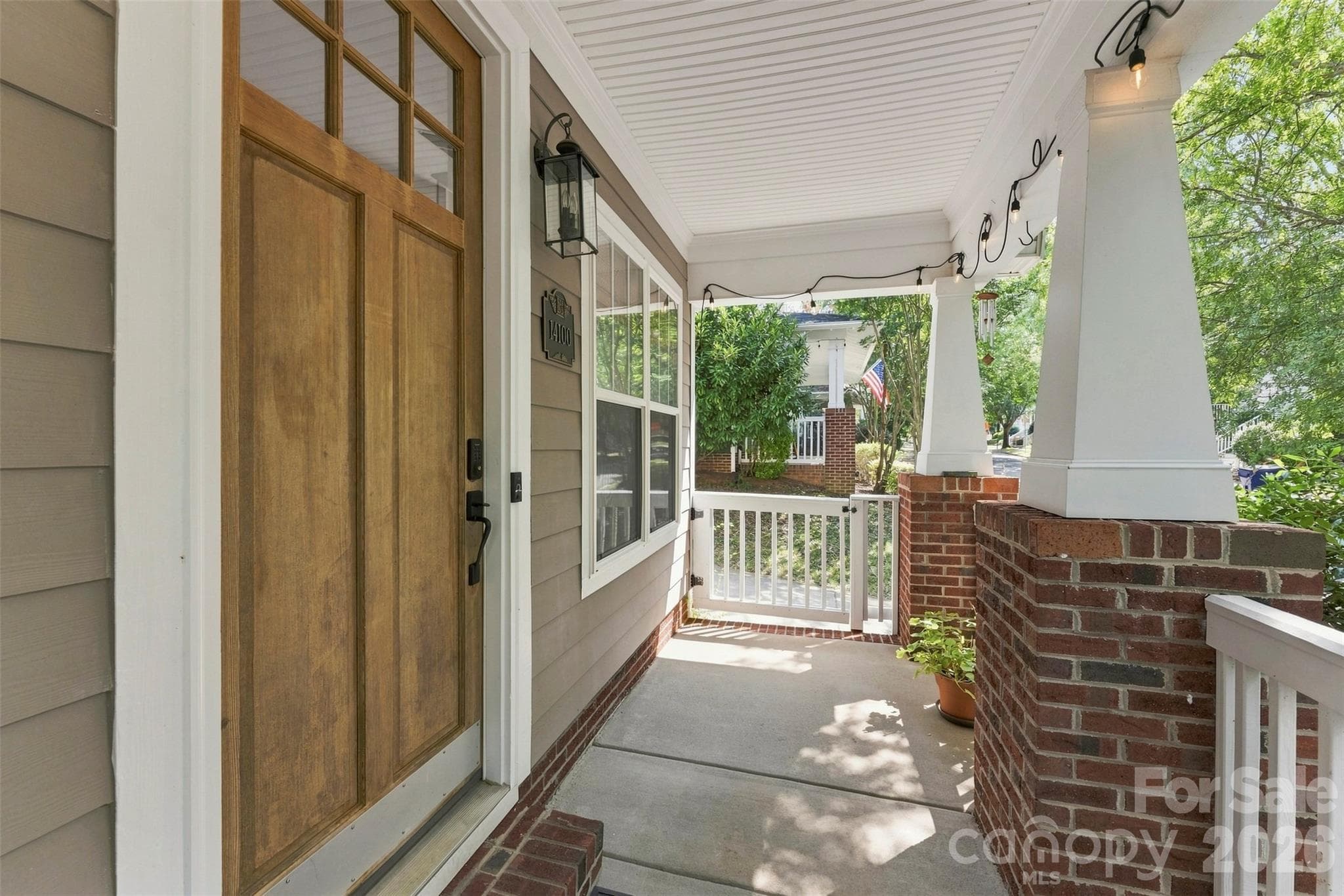 Shaded and welcoming front porch - 14100 Garden District Row, Huntersville