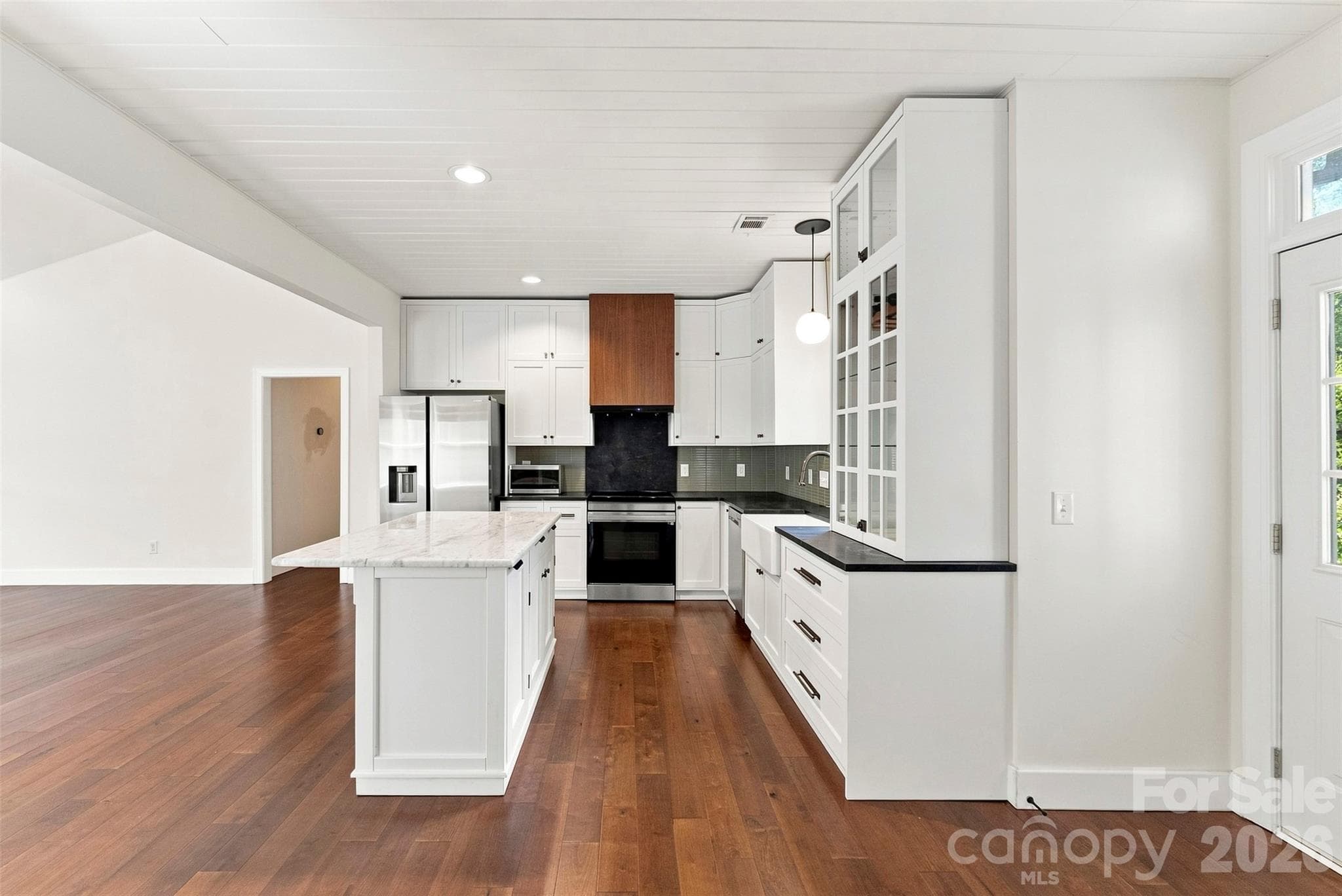 Kitchen with plenty of cabinets and soapstone countertops - 14100 Garden District Row, Huntersville