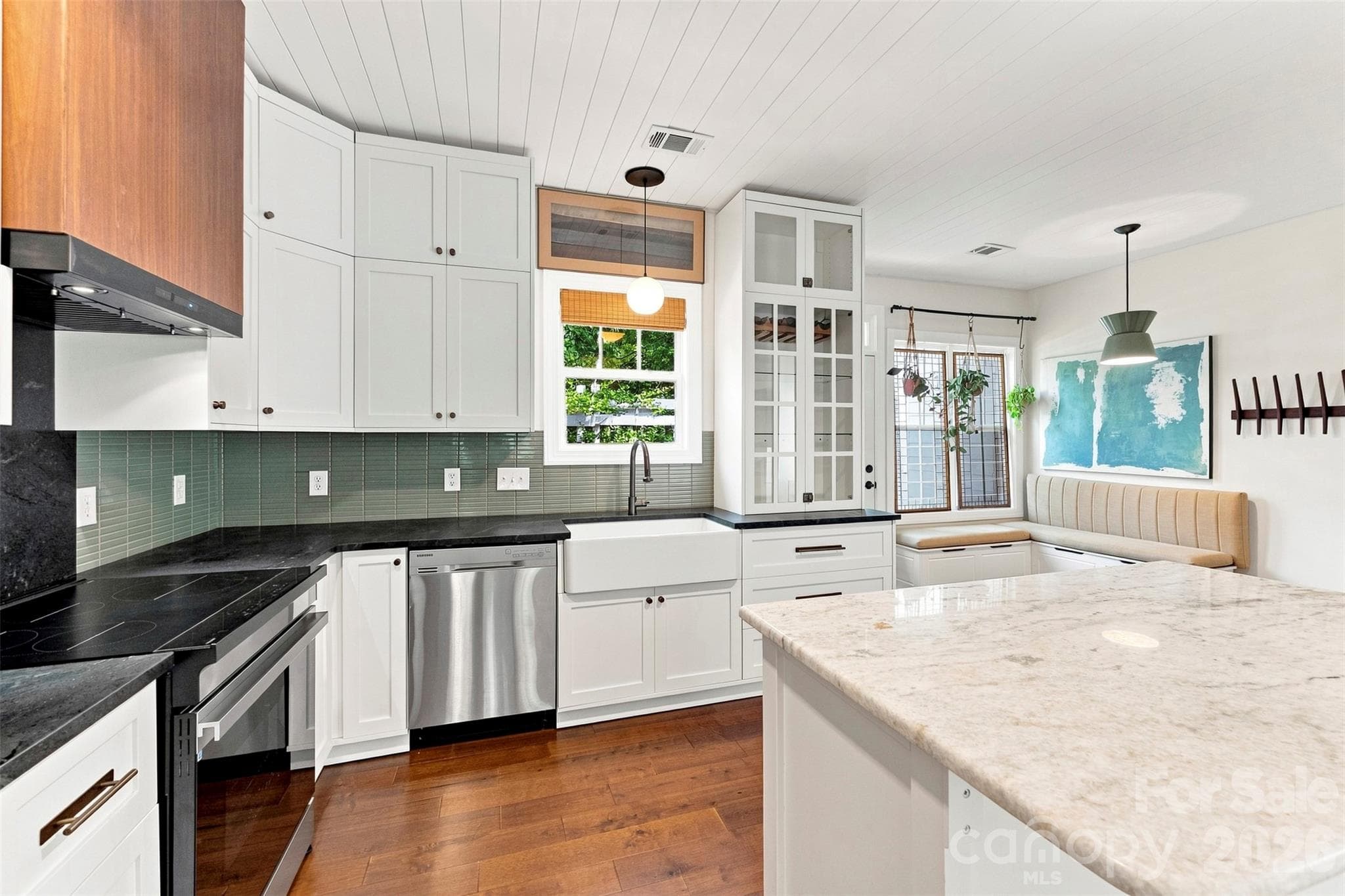 Kitchen with farmhouse sink and tile backsplash - 14100 Garden District Row, Huntersville