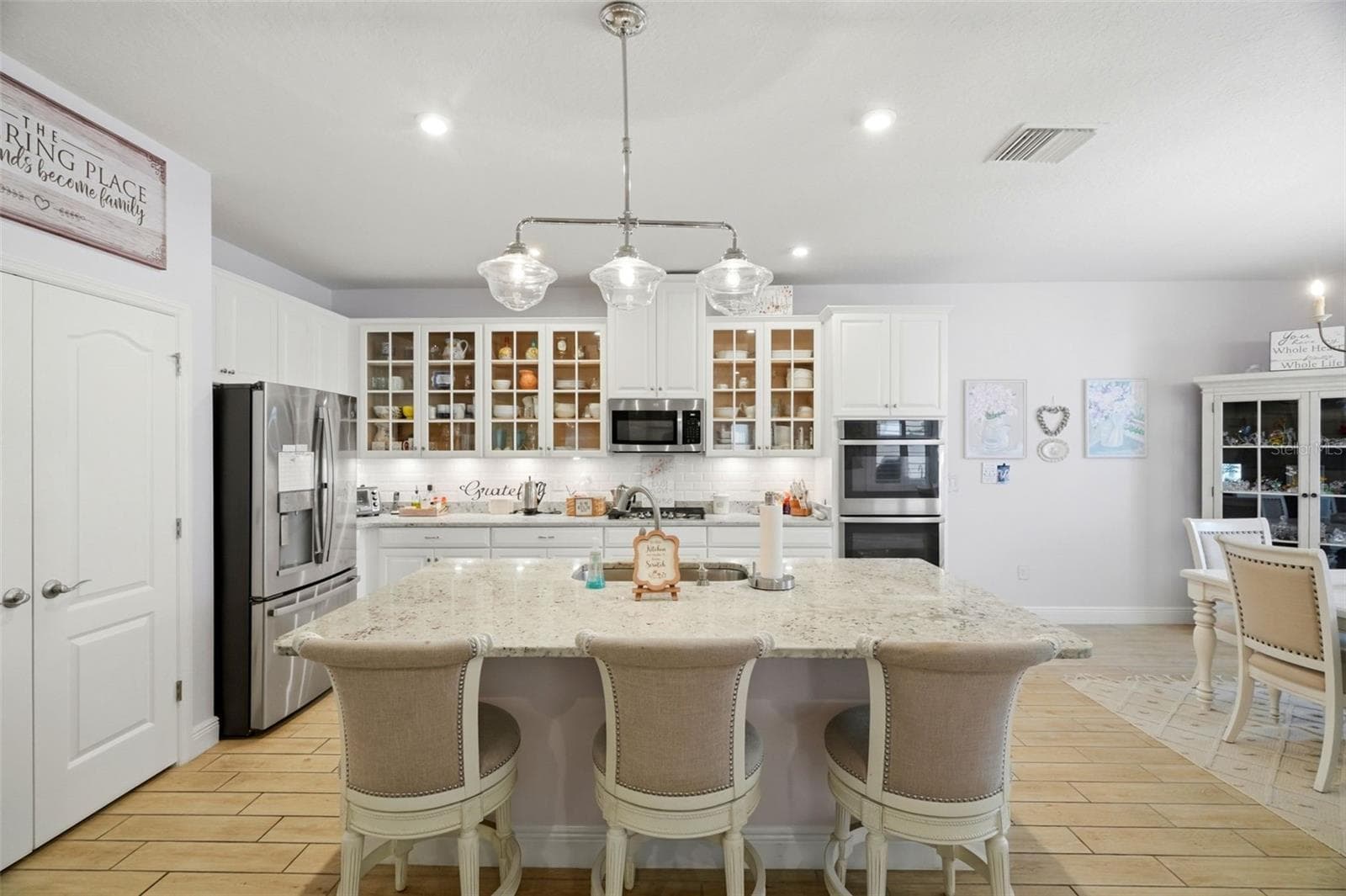 Large center island provides additional prep space, storage and seating. - 11750 LAKE LUCAYA DR, RIVERVIEW