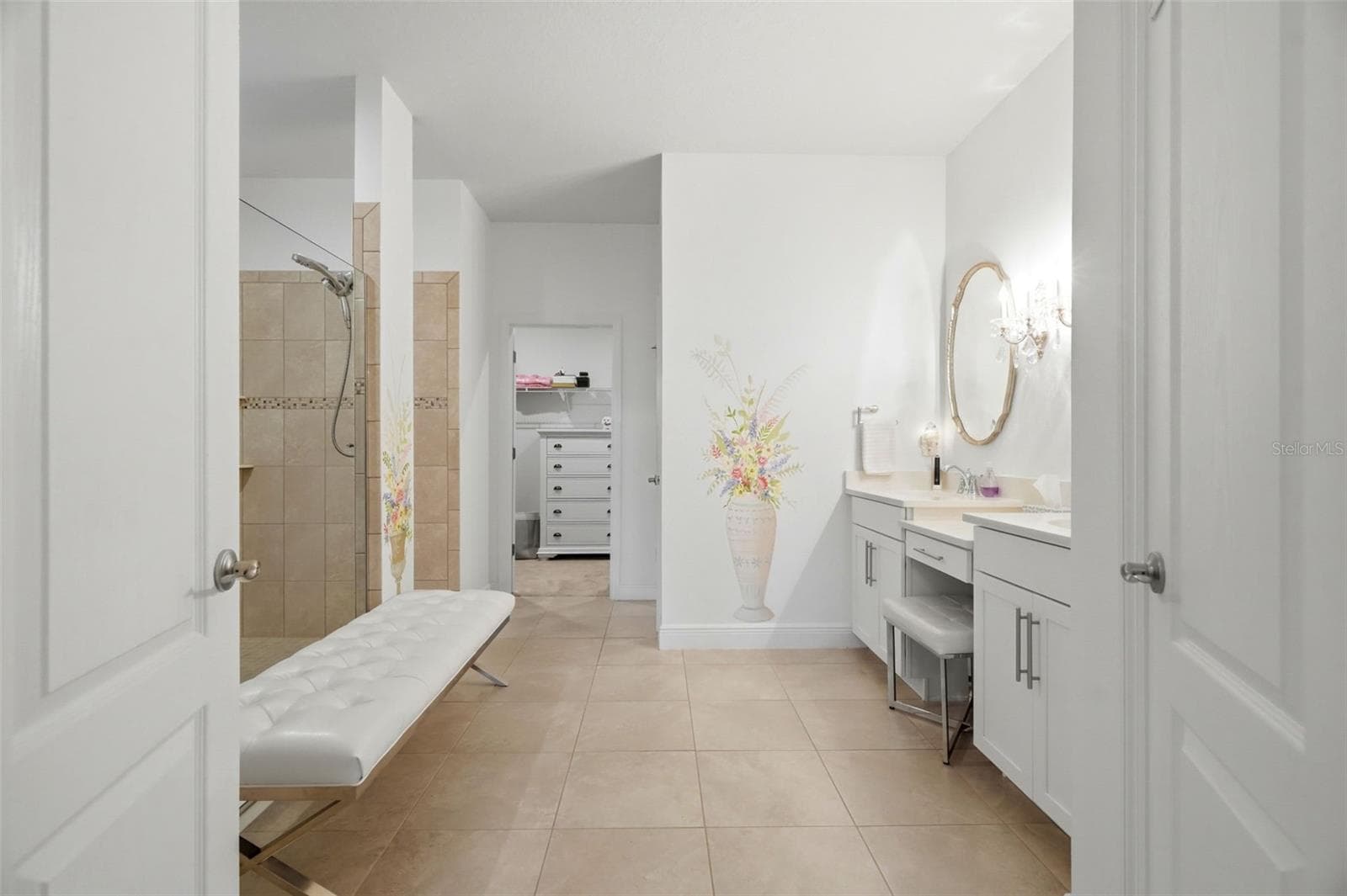 Spacious primary bath with dual vanities, extensive tilework and an oversized walk-in shower. - 11750 LAKE LUCAYA DR, RIVERVIEW