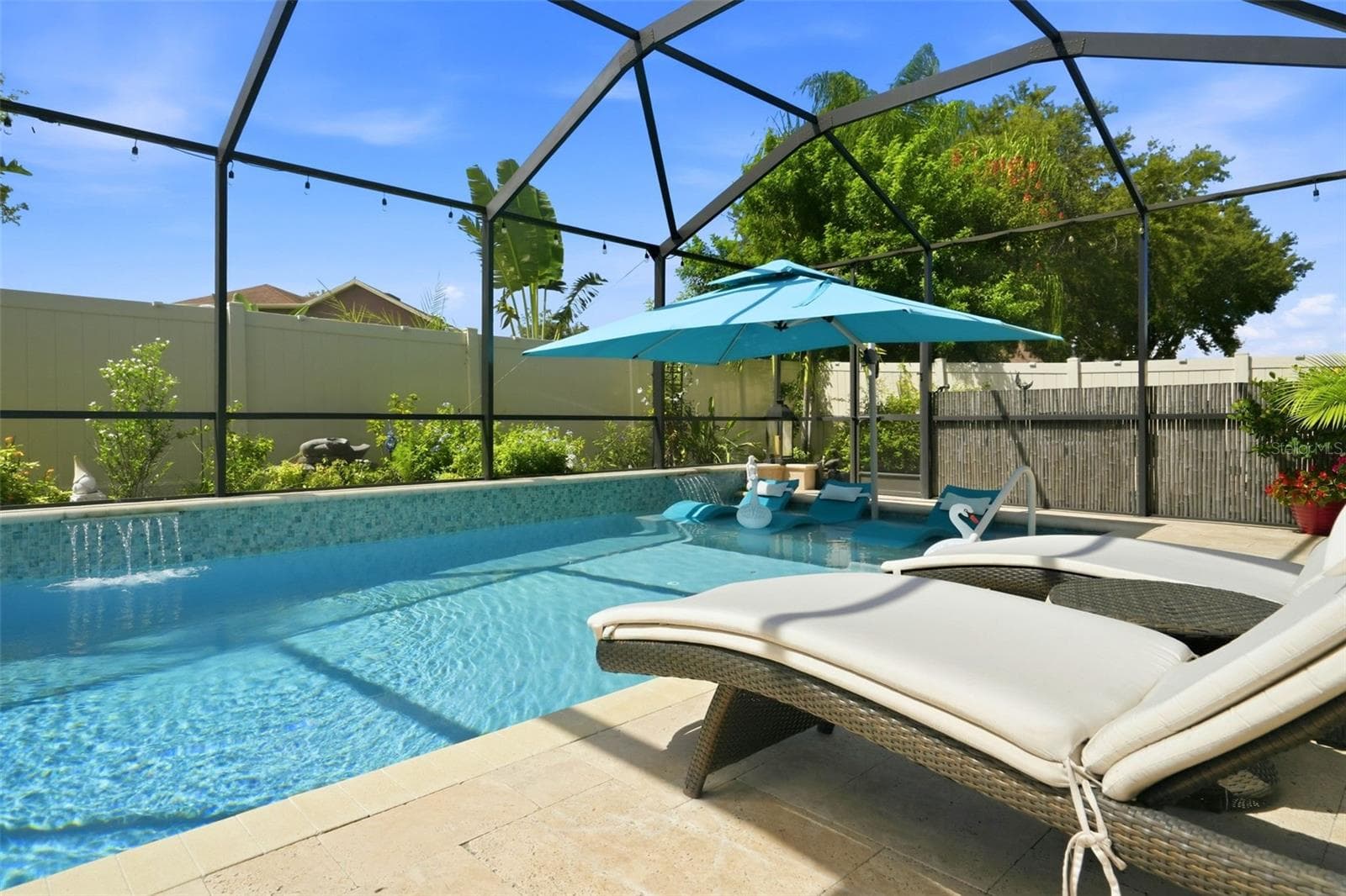 Saltwater pool with sun shelf, water features and a pool heat circulator pump replaced in 2025. Pool deck recently cleaned and sealed. - 11750 LAKE LUCAYA DR, RIVERVIEW