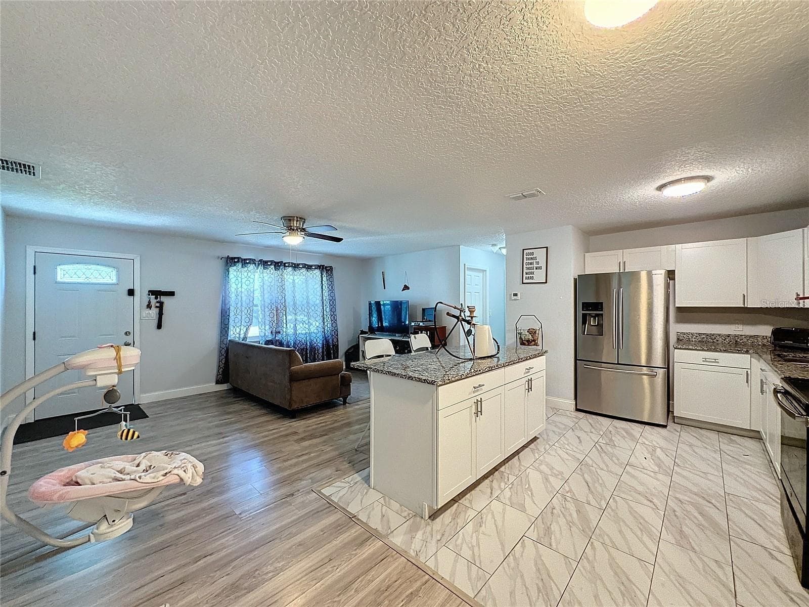 SIDE KITCHEN LIVING ROOM ANGLE - 7211 PINION DR, ORLANDO