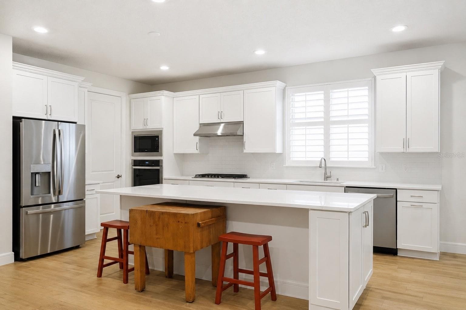 Kitchen Fridge with wall over and microwave - 2511 PINE PRESERVE CT, ST CLOUD