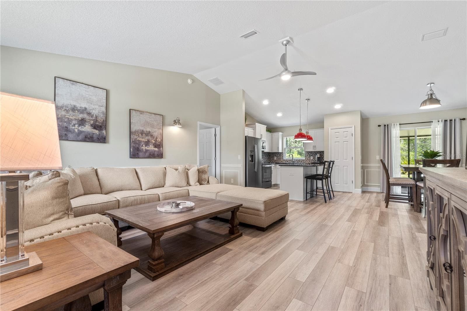 Spacious great room with an open layout, perfect for entertaining or relaxing. - 15994 SW 55TH AVENUE RD, OCALA