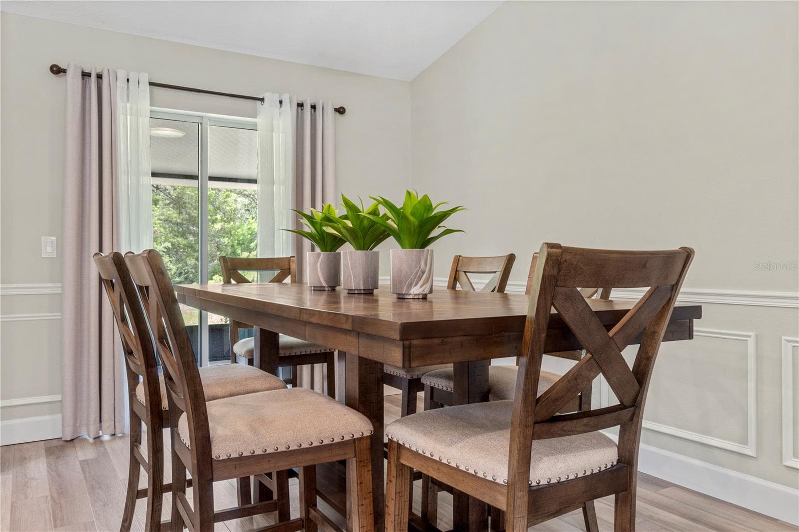 Dining area flows seamlessly from the kitchen, ideal for everyday meals or hosting. - 15994 SW 55TH AVENUE RD, OCALA