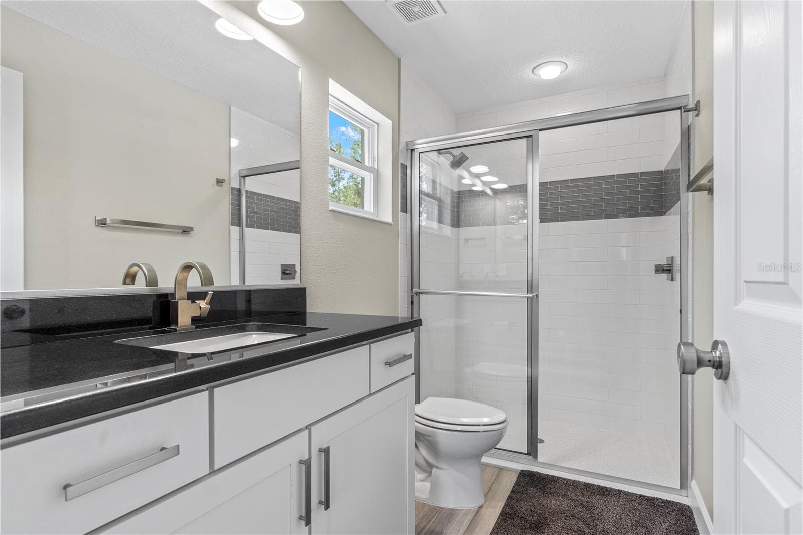 Luxurious ensuite bath with custom tile work, and walk-in shower - 15994 SW 55TH AVENUE RD, OCALA