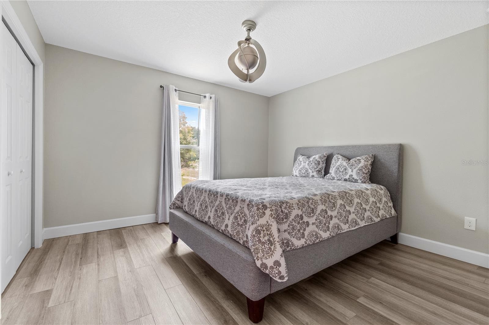 Third bedroom offers flexibility for family, guests, or a home office. - 15994 SW 55TH AVENUE RD, OCALA