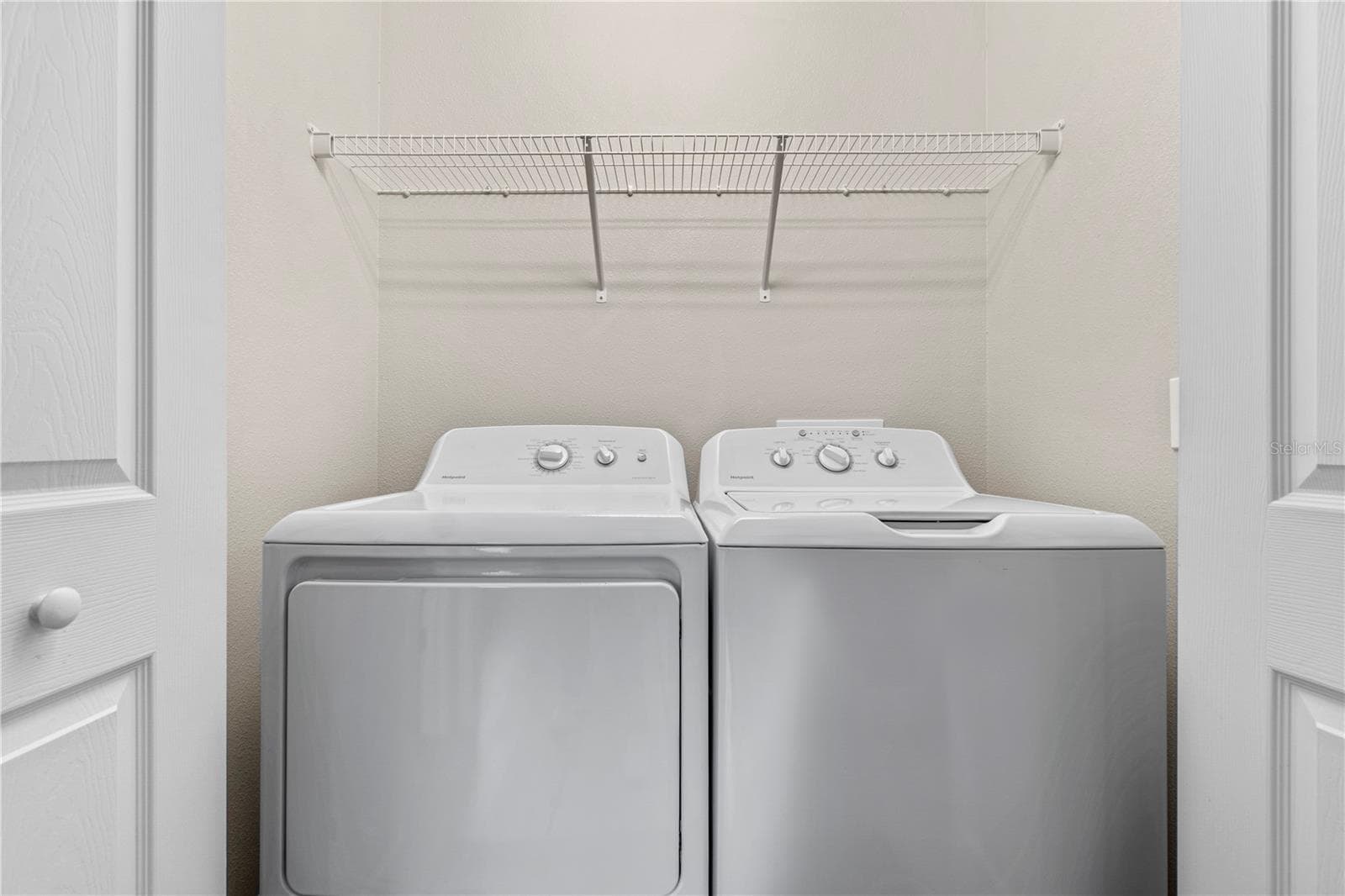 Convenient indoor laundry room adds everyday functionality. - 15994 SW 55TH AVENUE RD, OCALA