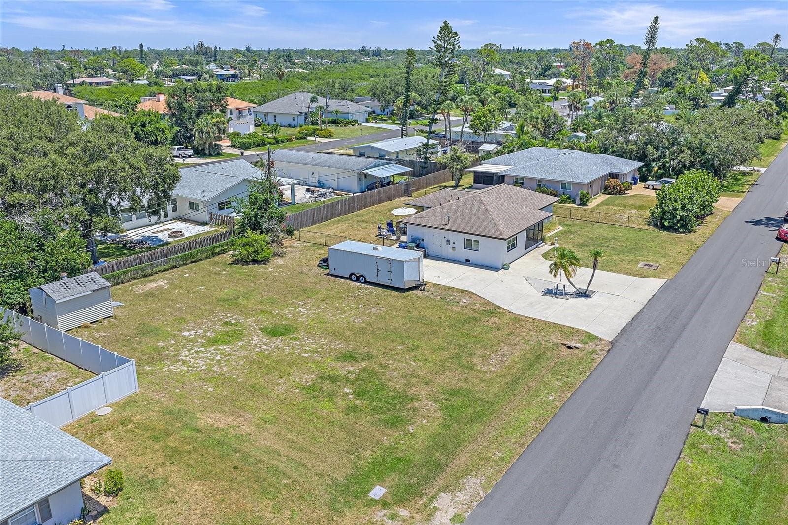 lot and house lot east view - 1488 JUPITER RD, VENICE
