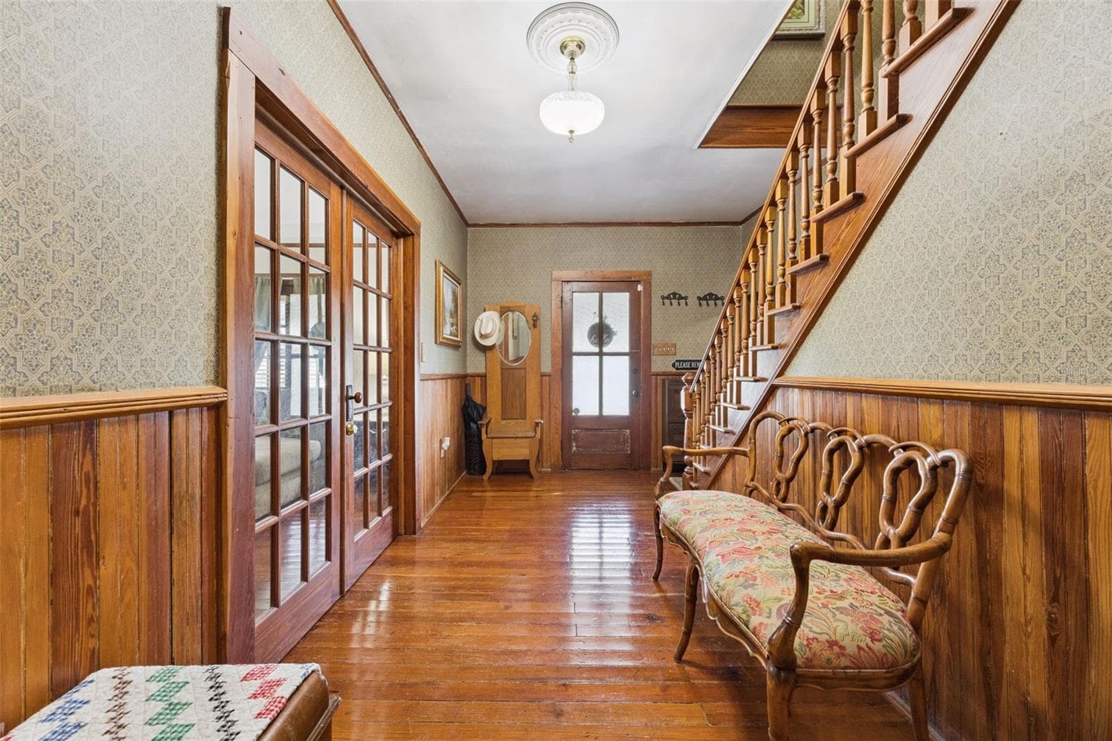 Step inside to original wood floors, rich millwork, French doors and a beautiful staircase that immediately establish the home's historic character. - 2201 CELERY AVE, SANFORD