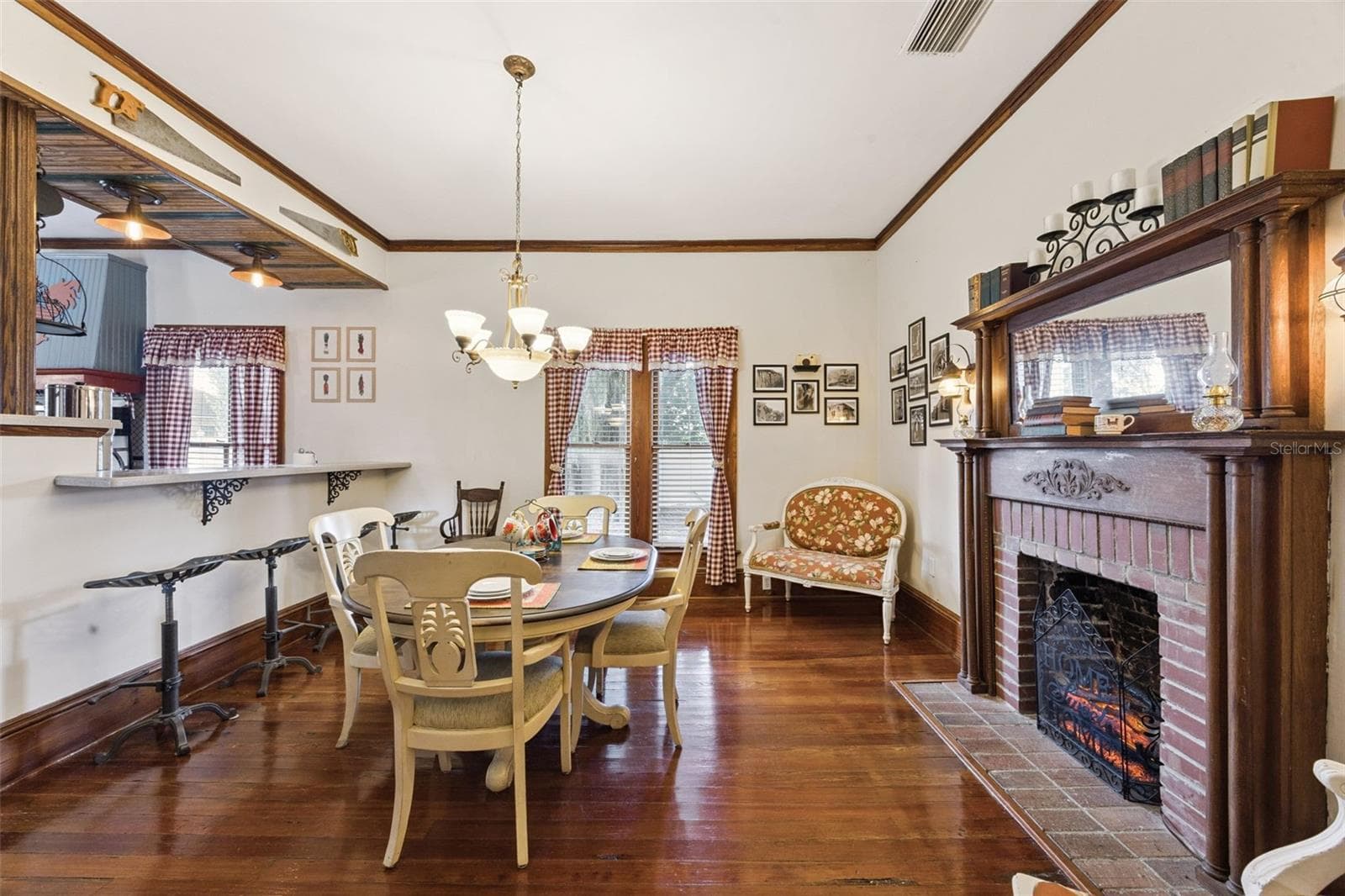 Original wood floors, substantial windows and a handsome fireplace give the home warmth and character. - 2201 CELERY AVE, SANFORD