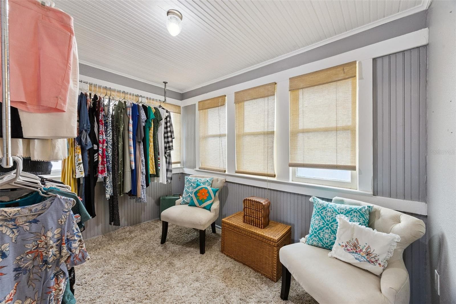 A former sleeping porch now offers wonderfully flexible bonus space — currently used as a dressing room and surrounded by windows. - 2201 CELERY AVE, SANFORD