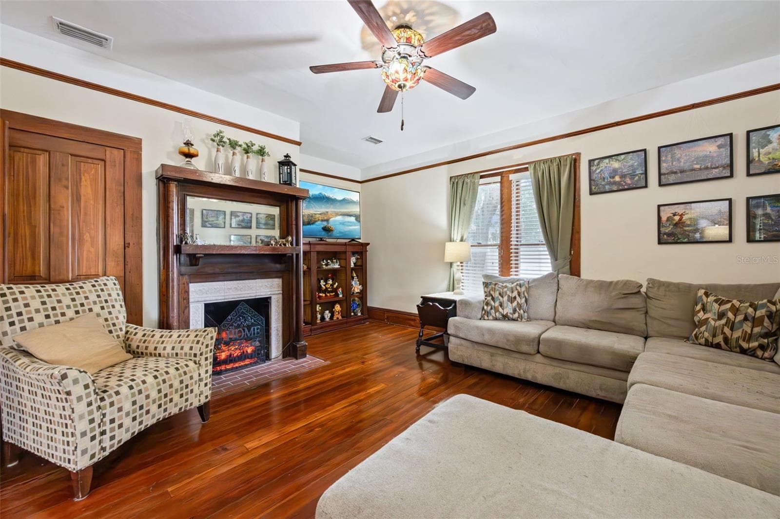 Original woodwork and a beautifully detailed staircase anchor the gracious central hall. - 2201 CELERY AVE, SANFORD
