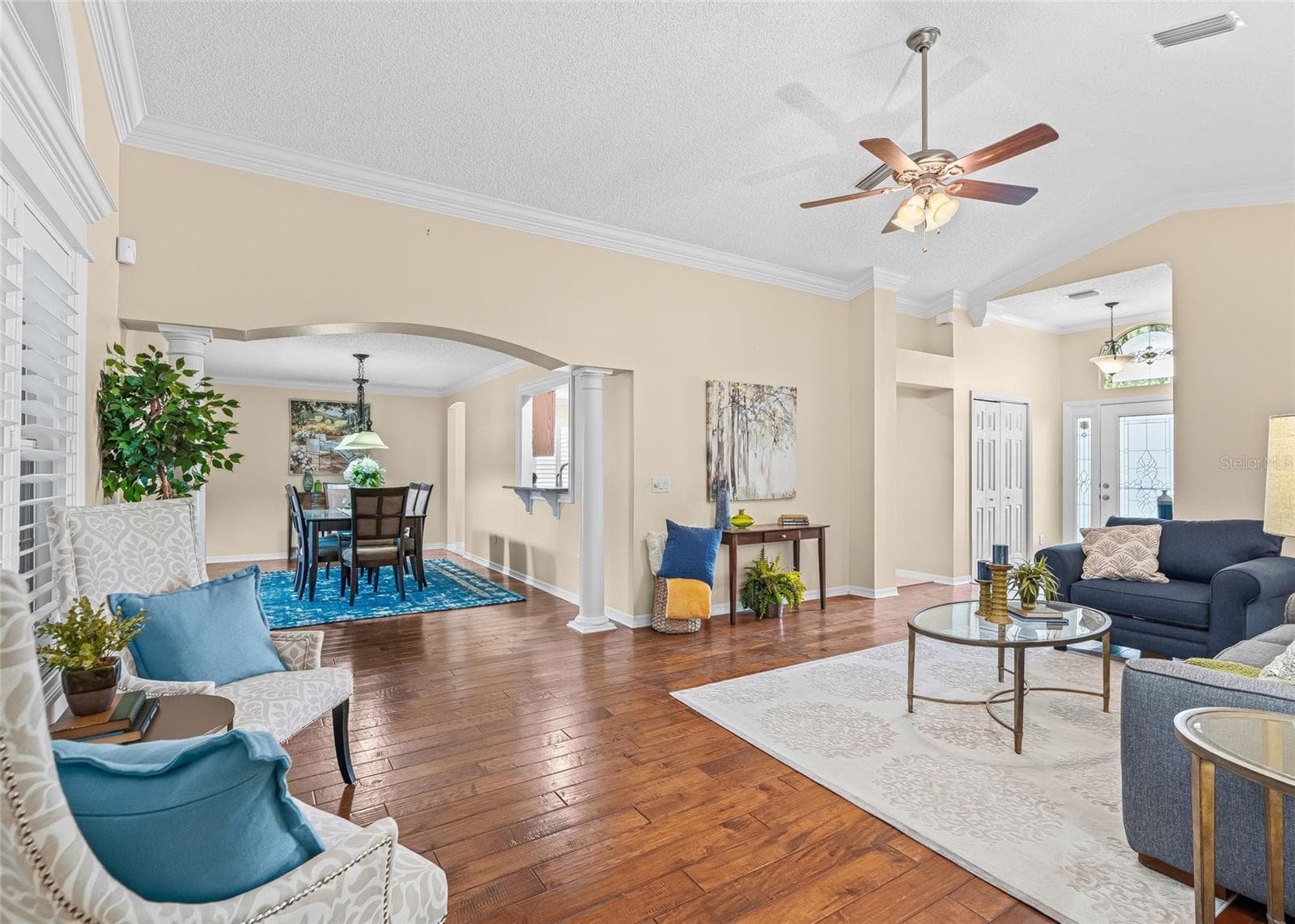 The open Living and Dining areas offer plenty of room for entertaining, enhanced by crown molding, decorative columns and abundant natural light. - 17601 SE 81ST TIMBERWOOD TER, THE VILLAGES