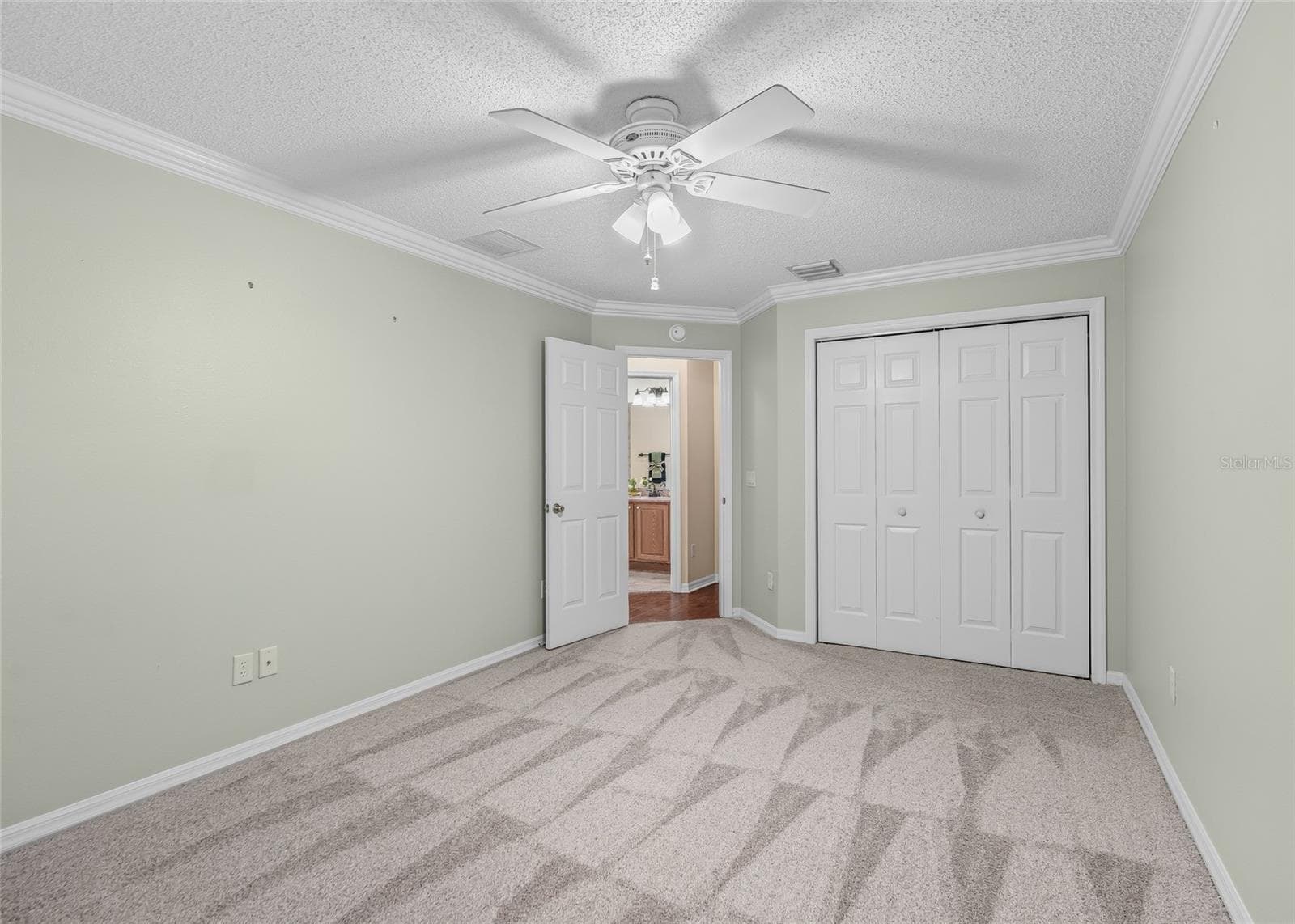 Another view of the Guest Bedroom highlights the generous room size, large closet and fresh, never-lived-on carpeting. - 17601 SE 81ST TIMBERWOOD TER, THE VILLAGES