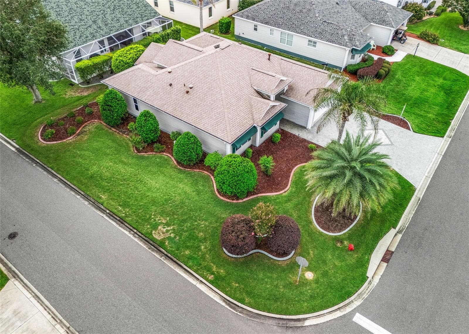 From above, you can really appreciate the size of the corner lot, extensive landscaping and the expanded footprint of this Hawthorne/Oleander design. - 17601 SE 81ST TIMBERWOOD TER, THE VILLAGES