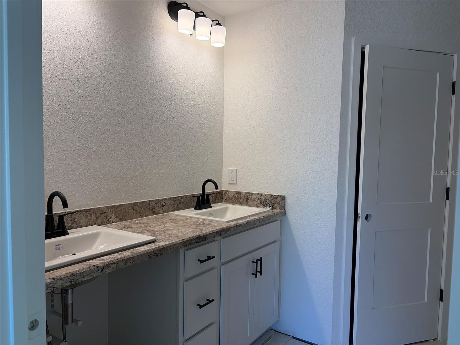 Under construction. Current state of build as of 9-5-26. Master Bath - 7 BAHIA PASS LN, OCALA