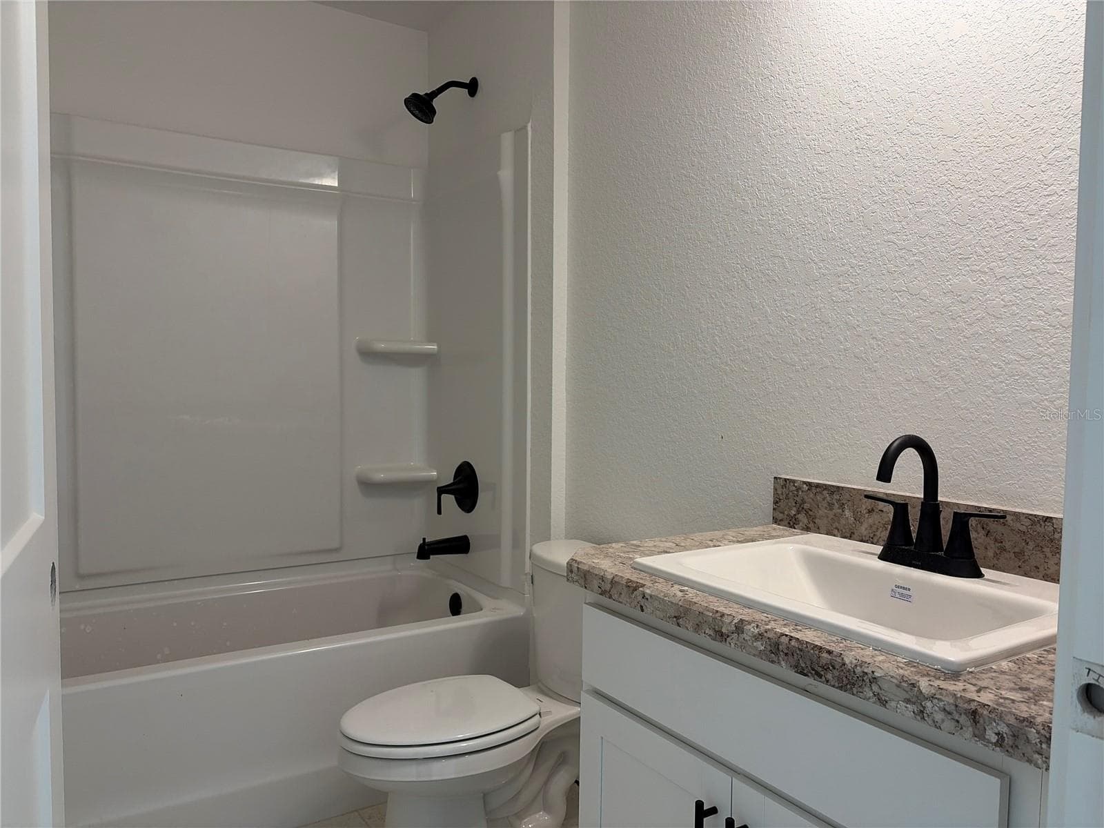 Under construction. Current state of build as of 9-5-26. Guest Bath. - 7 BAHIA PASS LN, OCALA