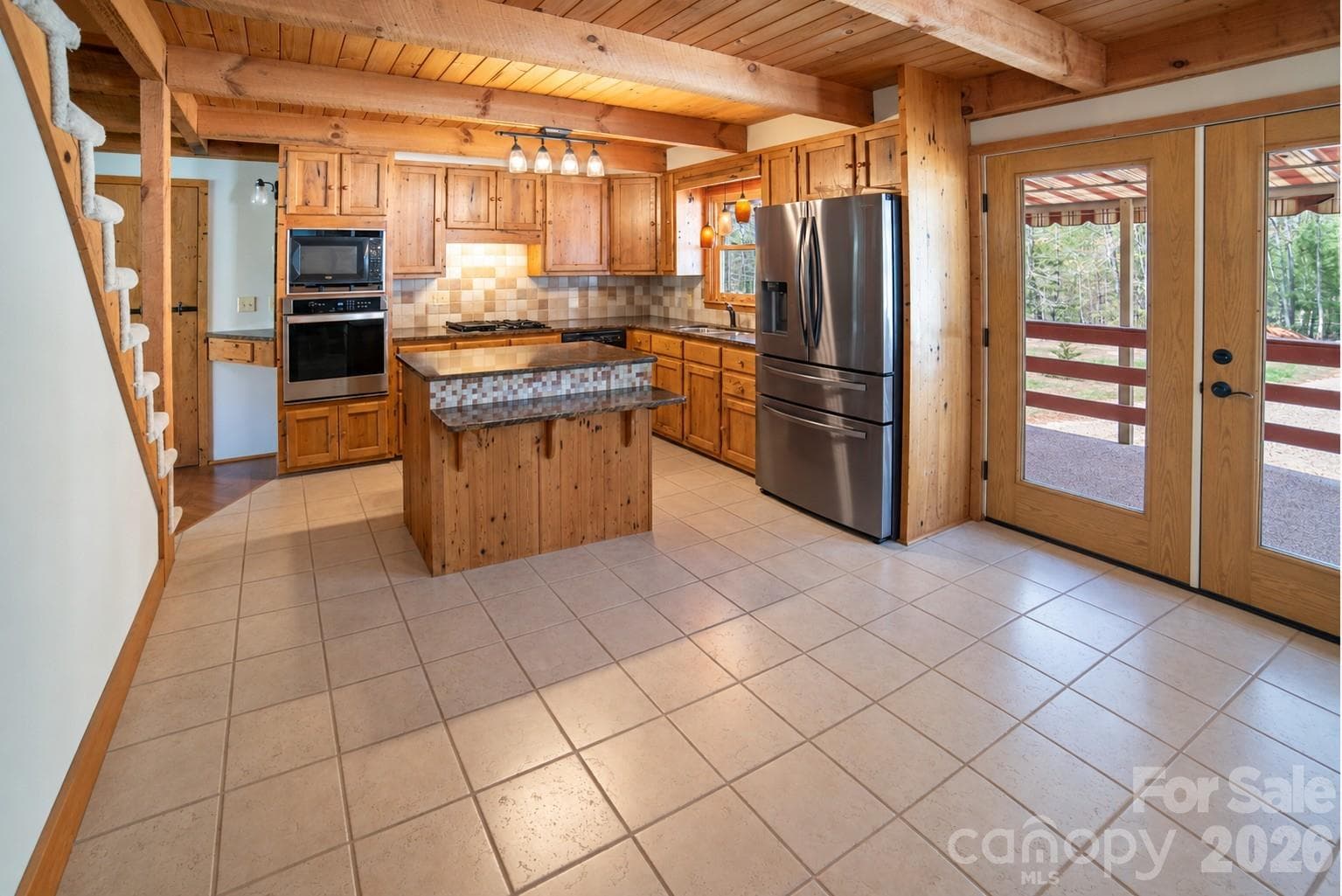 Kitchen joins expansive Dining space - 1368 Cajah Mountain Road, Hudson