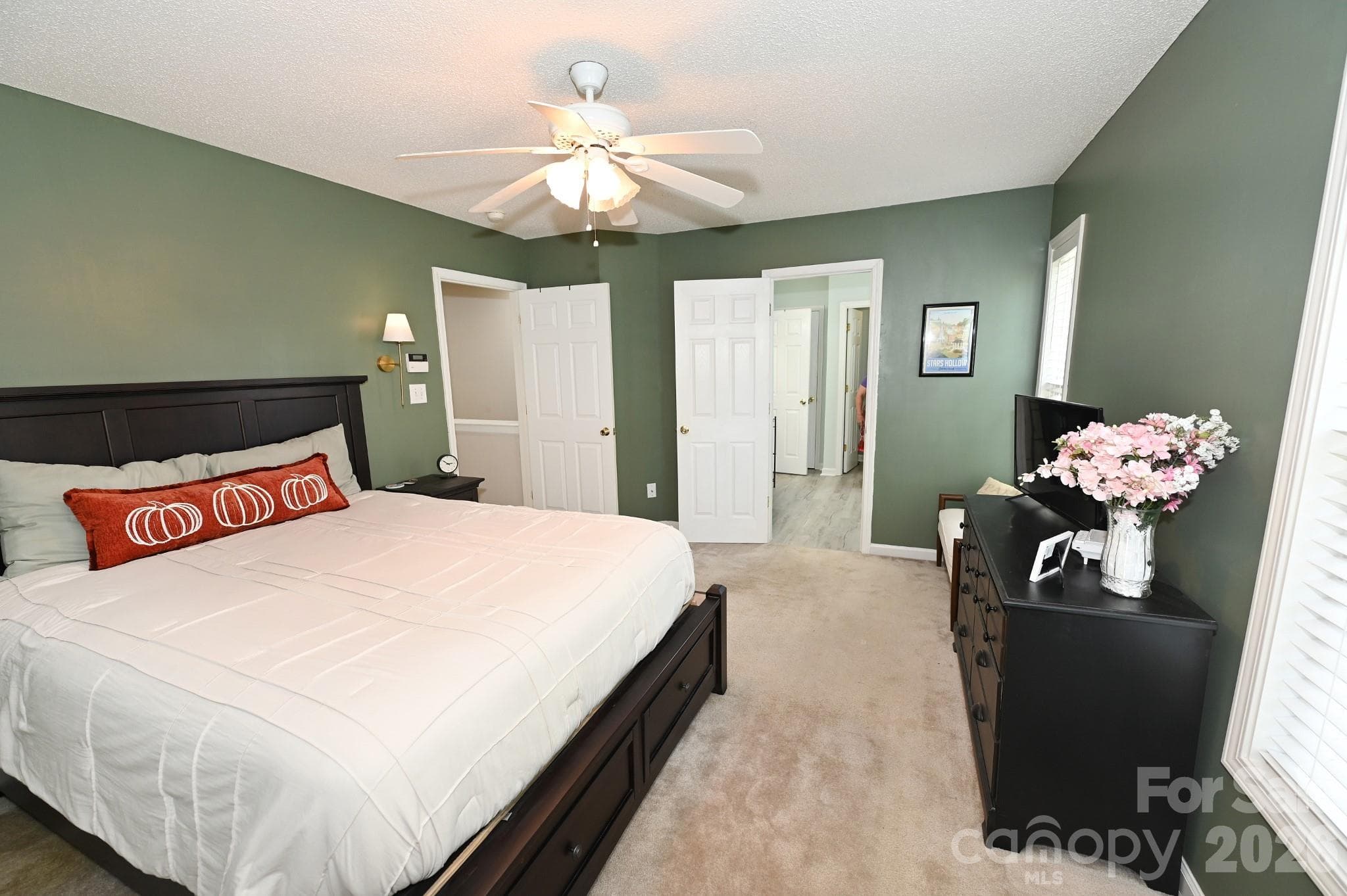 Primary bedroom- Door to the left is the hallway, door to the right is the en suite bathroom and walk in closet - 236 17th Avenue SE, Hickory