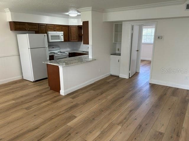 Living Room looking into Kitchen with Breakfast Bar and room for stools - 2873 S OSCEOLA AVE #A5, ORLANDO