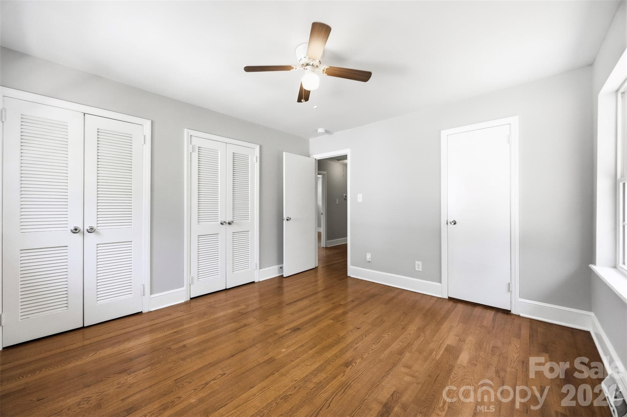Primary BR 2nd look showing twin closets and a single door that leads to a powder room. - 6506 Candlewood Drive, Charlotte