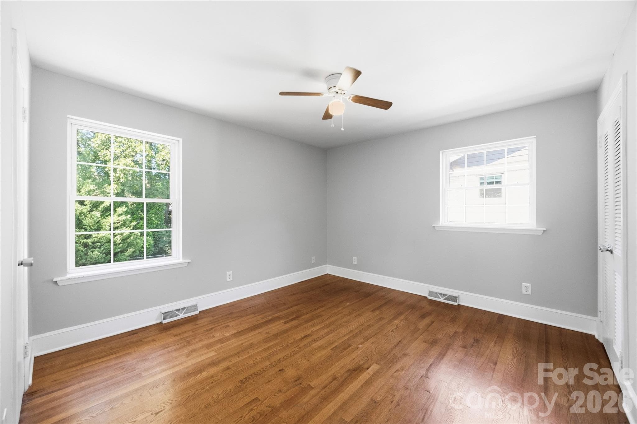 Primary BR showing no furniture. Space, light and beautiful hardwood floors. - 6506 Candlewood Drive, Charlotte