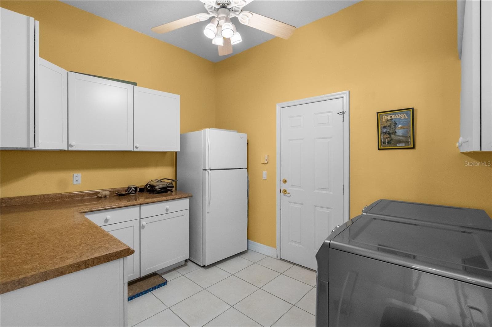 Utility room with plenty of cabinets and work area. - 82 LAGARE ST, PALM COAST