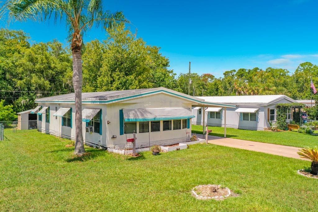 Side and Front of House - 1157 CAPELLA DR, TAVARES
