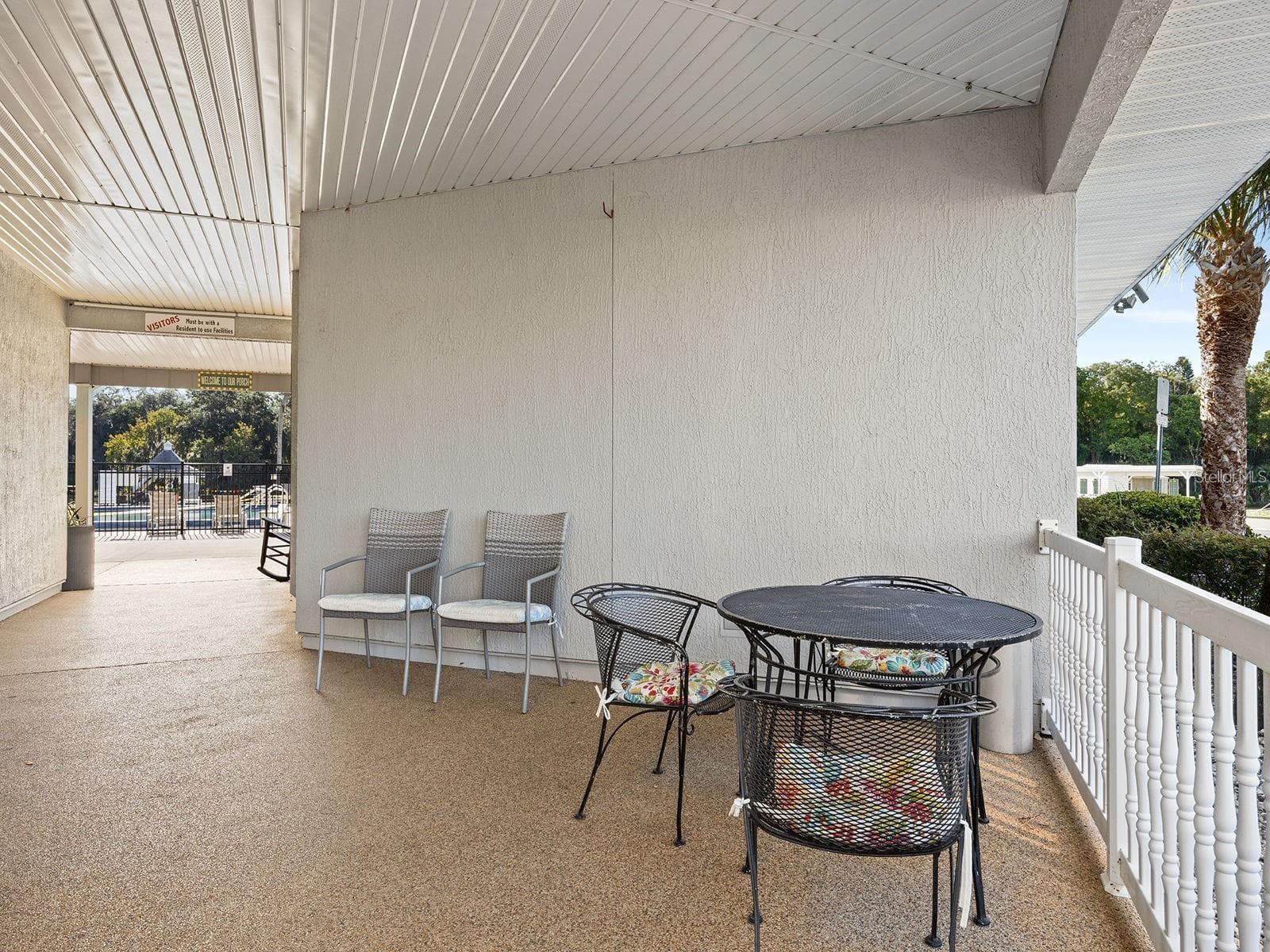 Breezeway to Patio, Pools, and Game//Pool Bldg - 1157 CAPELLA DR, TAVARES
